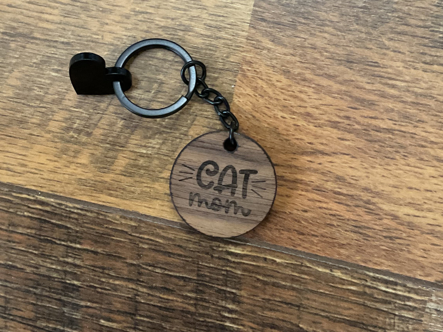 Keychain with a wooden tag on a wooden surface